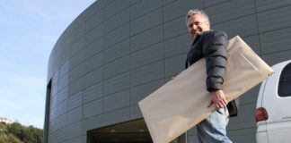 Nic Foster carries artwork into the Trafalgar Centre for this weekend’s Nelson Art Expo. Photo: Andrew Board.