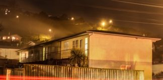 Smoke coming from a block of flats in Washington Valley on Friday night after an oil fin heater burst into flames. Photo: Phillip Rollo.