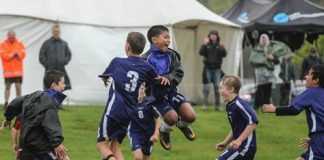 INTO THE FINALS: Nelson Royal 11th grade players celebrate winning the Jack McKnight semi-final on Saturday morning. They are from left; Simon Wilson, Alex Lindbom, Bawi Chung Hichal and Lucas Hogg. Photo: Phillip Rollo.