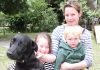 Wakefield’s Katie Pearless with her children Tayla, 8, and Lewie, 2, with their remaining dog Baz. Photo: Andrew Board.