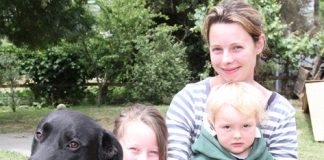 Wakefield’s Katie Pearless with her children Tayla, 8, and Lewie, 2, with their remaining dog Baz. Photo: Andrew Board.