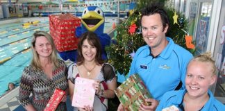 Donating presents to the Women’s Refuge this year is Riverside Pool staff and customers. Pictured from left is Trudie Brand and Fraye Bruce-Martin of the Women’s Refuge and Dave McKenzie and Lisa Bergman from Riverside Pool. Photo: Andrew Board.