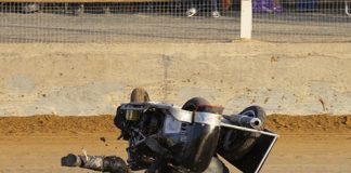 Sidecar riders Noel Puklowski and Ben Keys roll during a frightening moment at the Nelson Speedway on Saturday. Photo: Phillip Rollo.