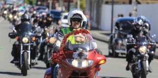 Kyle Neeley leads more than 400 motorcyclists through Queen St during Saturday’s Ulysses Nelson Toy Run. Photo: Phillip Rollo.