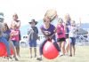 Laura Inglis, 10, is cheered on by team mate Nikita Aitkenhead, 10 and sister Kiera Inglis, 9, during the ‘kids go racing’ moon hopper event held at the races on Friday. Photo: Sinead Ogilvie.