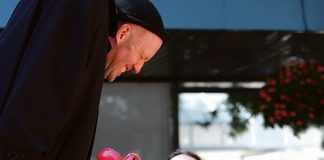 Tanya Whitehead with performer Dado during a Buskerburgoo street theatre show at the top of Trafalgar St on Saturday. Insert: Beni Rae, 8, after being pulled out from the audience during the show. Photos: Sinead Ogilvie.