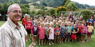 Hira School students and teachers with principal Kevin Ward. Hira is a decile 10 school, according to the Ministry of Education. Photo: Andrew Board.