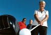 Harvey Norman Fourball Championship tournament director Norma Adams lines up a shot with Norman Rapson and Keir Wilkinson in the background. Photo: Andrew Board.