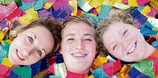 Garin College students Sjann Hungerford, Clare Sanders and Veronica Mitchell, 17, surrounded by the 5 Gum wrappers they are collecting for the schools arts festival. Photo: Sinead Ogilvie.