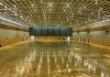 Staff work at mopping up the flood-damaged floors at Saxton Stadium on Monday morning. Photo: Phillip Rollo.