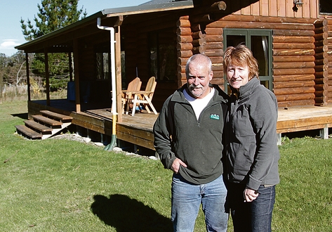 glenhope 006 Steve Garnett and Tracey Lynch in front of a lodge on their property, close to where the fire started. Photo: Andrew Board.