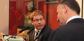 Nelson Bays Heritage Trustee Chris Bowater accepts Keith Holyoake’s old typewriter as a gift from Prime Minister John Key.