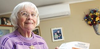 Stoke woman Olga Reid with her power bill that has sky rocketed from around $130 to $350. Photo: Andrew Board.