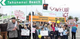 Protesters at the end of their walk down Tahunanui Dr on Friday afternoon. They want major traffic to stop being forced through the village. Photo: Sinead Ogilvie.