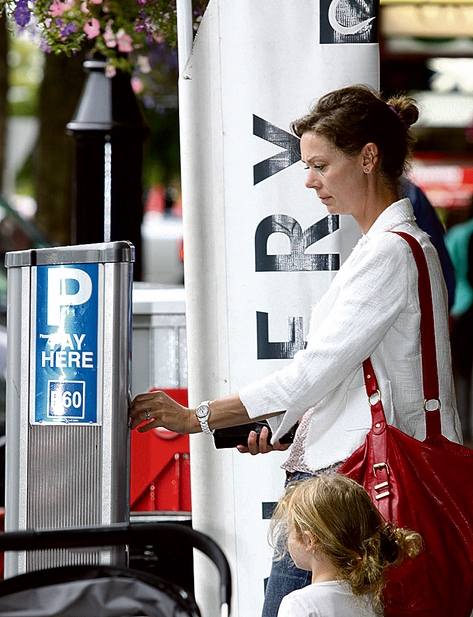 Juliet Wilson of Stoke paying for parking in the city centre on Monday.