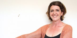 Julie Redwood after losing 50kg and with her old jeans. Photo: Andrew Board.