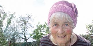 Margaret Green with the recycled and donated goods she sells at a local car boot sale. Photo: Sinead Ogilvie.