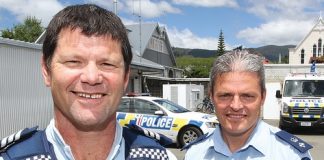 Sergeant Mike Wardle who was presented with a bravery award on Sunday. He is pictured with Tasman commander Richard Chambers. Photo: Andrew Board.