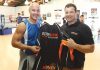 Monty Betham is presented with a Victory Boxing Club hoodie by Paul Hampden when he visited the gym last week. Photo: Andrew Board.