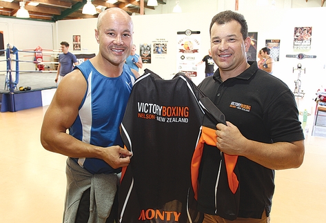 boxing Monty Betham is presented with a Victory Boxing Club hoodie by Paul Hampden when he visited the gym last week. Photo: Andrew Board.