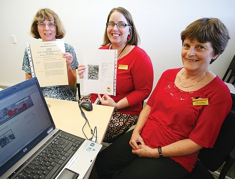 roll1 Karen Dickerson, Louise Gribbon and Cathy Vaughan with the Roll of Honour of soldiers from the Nelson-Tasman region who died in World War I which has been digitised and posted online. Photo: Simon Bloomberg.