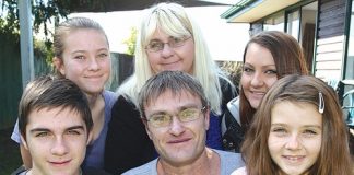 Mike Corkill, centre, with his wife and children from left; Liam, 17, Brittany, 14, Julie-Ann, Cassie, 21, and Teigan, 9. Absent is Mike's eldest son Ethan, 19. Photo: Andrew Board.