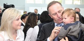 Prime Minister John Key holds baby Reuben while speaking with the baby’s mother Marise Bainbridge at the official opening of the Nelson Young Parents’ School. Photo: Andrew Board.
