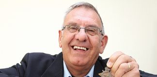 Nelson RSA president Barry Pont with some of the First World War medals that have been donated over the years. He’s holding a Gallipoli medal. Photo: Andrew Board.