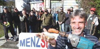 At a barbeque last week to discuss a building for the Nelson Menzshed is Graeme O’Brien with some of the other locals keen to see a Menzshed established in the city. Photo: Andrew Board.