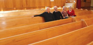 Members of the Stoke Methodist Church with the 20 pews that are up for sale. They are, from left, Keith Drogemuller, Gary Clover, Jan Thompson and Val Knight. Photo: Andrew Board.