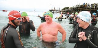 Swimmers, from left, Richard Ussher, Steve Malthus, Digby Kynaston and Kerry Mathieson brave the cold as they enter the water for the Blue September charity sea swim in Port Nelson on Sunday. Photo: Simon Bloomberg.