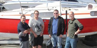 Members of the Nelson Coastguard have assembled a team to restore a yacht donated by Nelson Weekly. The yacht will be tided up and raffled off, with all of the money raised going straight to the Coastguard. The team are from left; Graeme Richards, Mark Howard, Dave Brookes and Emmett Mills. Photo: Jessie Johnston.