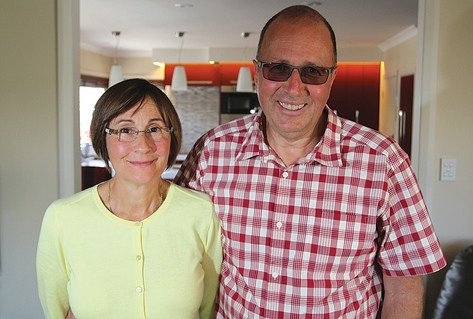 bashed cop (12) Senior constable Peter Buzzard with his wife Debby, 17 months after a brutal attack on Peter. Photo: Andrew Board.