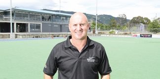 Nelson Hockey's development officer, Craig Brett, on the Saxton Field hockey turf that will host a New Zealand hockey test for the first time in 62 years. Insert left: The cover of the test programme the last time New Zealand played a test in Nelson, against Australia in 1952. Insert right: The New Zealand that played the Nelson test, including Nelson man Fred Gribble [circled]. Photo: Andrew Board.