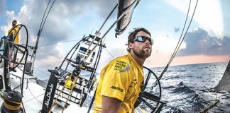 Daryl Wislang on board Abu Dhabi Ocean Racing during the second leg of the Volvo Ocean Race. Daryl is the pit and boat captain and is currently racing the third leg of the race from Abu Dhabi to China. Photo: Ian Roman. Insert: Daryl waves goodbye to his family while heading back on his yacht before the start of the third leg. Photo: Andrew Board.