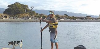 Mark Rayner arrives at Tahunanui after completing his SUP journey from Marahau on Friday.