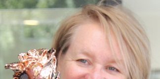 Tanya Rowe with the 24 carat gold-plated rose that the Nelson Weekly and Jens Hansen will be giving away this Valentine’s Day. Photo: Jessie Johnston.